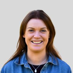 Image of woman smiling at the camera. Lauren Vertigan Strategic Grants